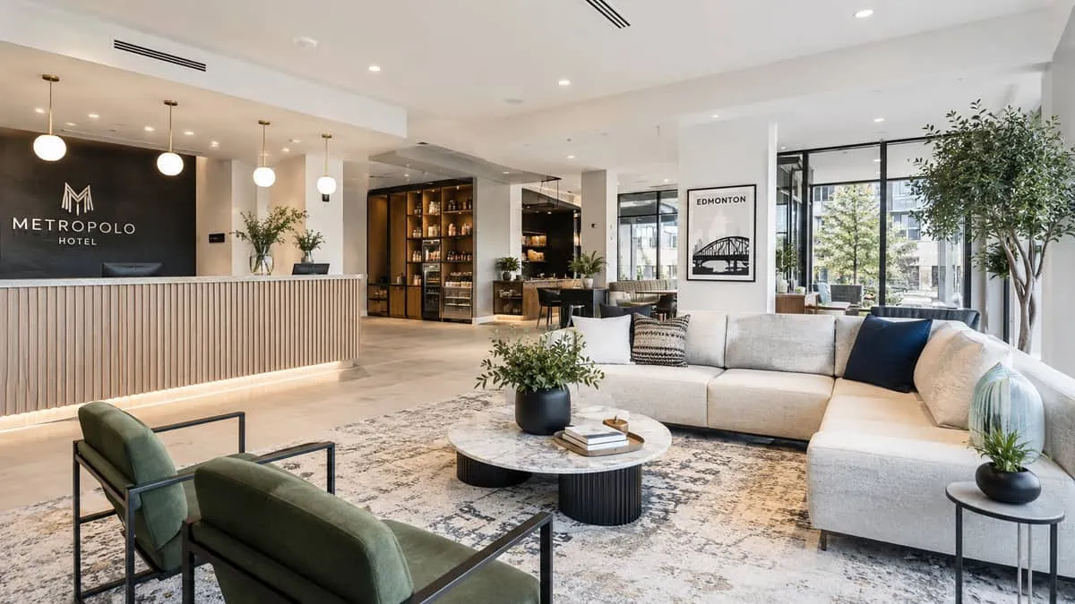 a boutique hotel lobby in Edmonton showing cohesive furniture selection including a reception area with upholstered seat
