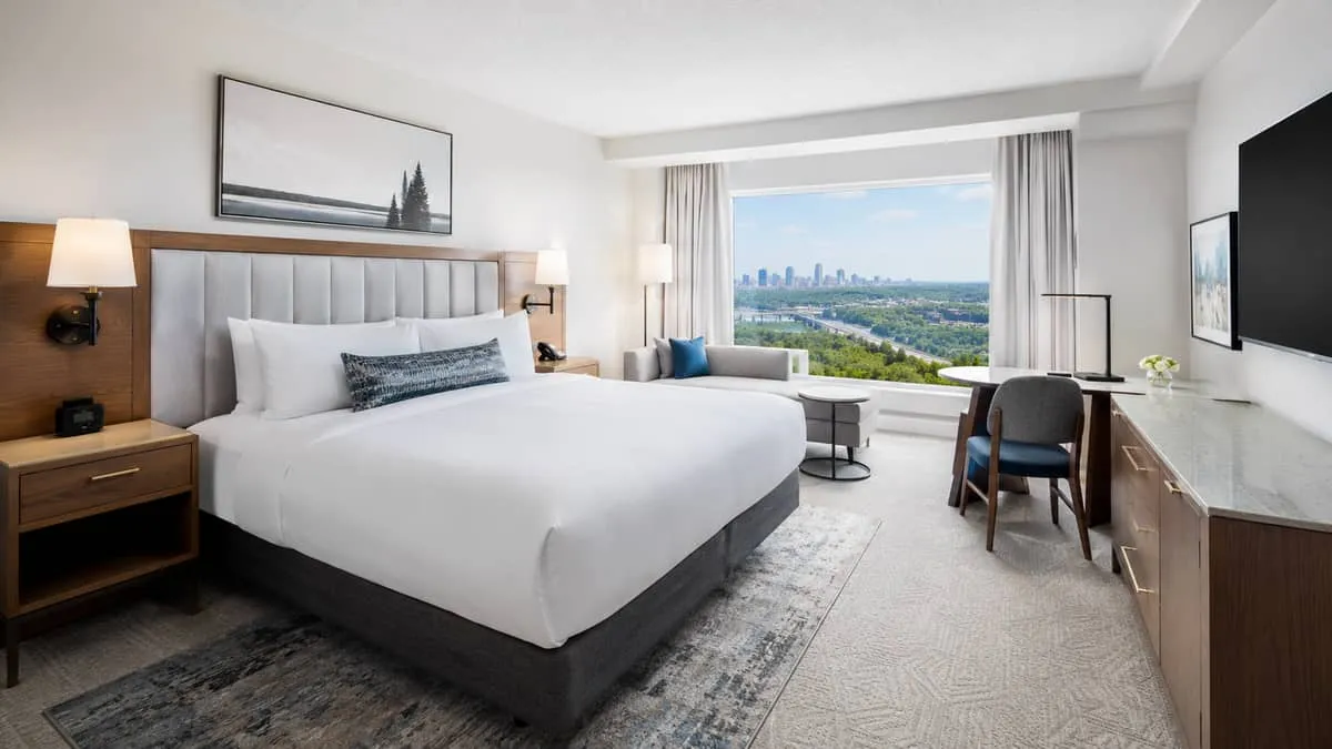 a completed boutique hotel guest room in Edmonton showing the final result of a well-sourced furniture package, with an