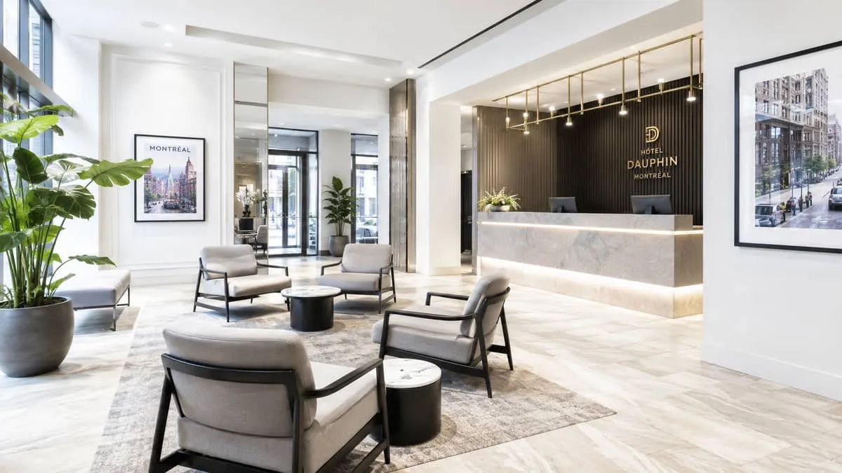 hotel reception waiting area with open-base armchairs and low side tables arranged to allow clear foot traffic flow, neu