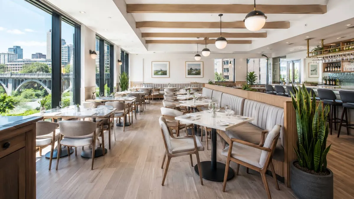 a Saskatoon restaurant patio or indoor dining room fully furnished with contract-grade seating, showing a cohesive desig