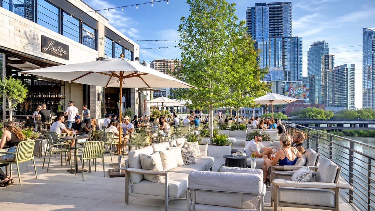 Commercial patio picnic tables installed at an outdoor venue