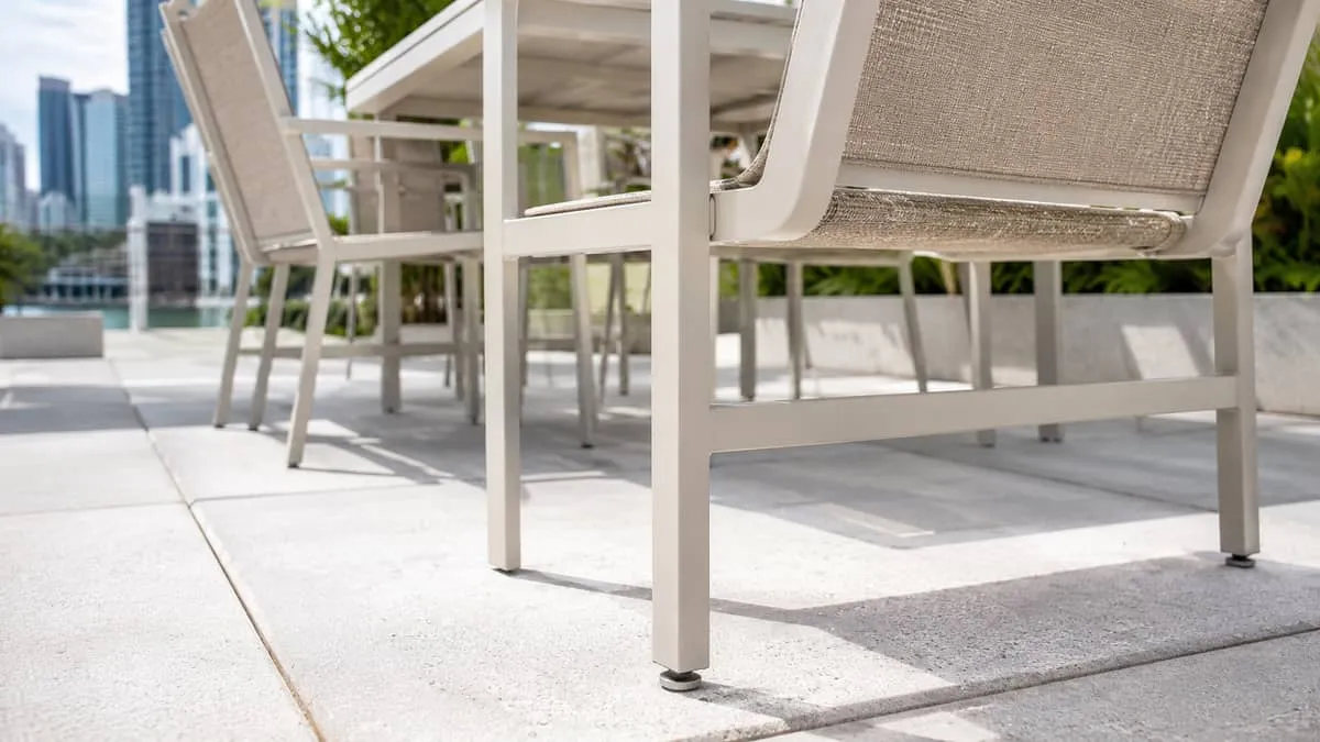 Atlanta BeltLine patio furniture showing matte charcoal powder-coat aluminum dining chairs with industrial aesthetic suited to Old Fourth Ward restaurant corridor