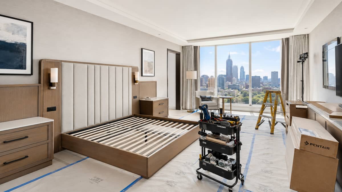 Hotel renovation furniture staged for delivery to an occupied Bend, OR property showing phased room refresh logistics