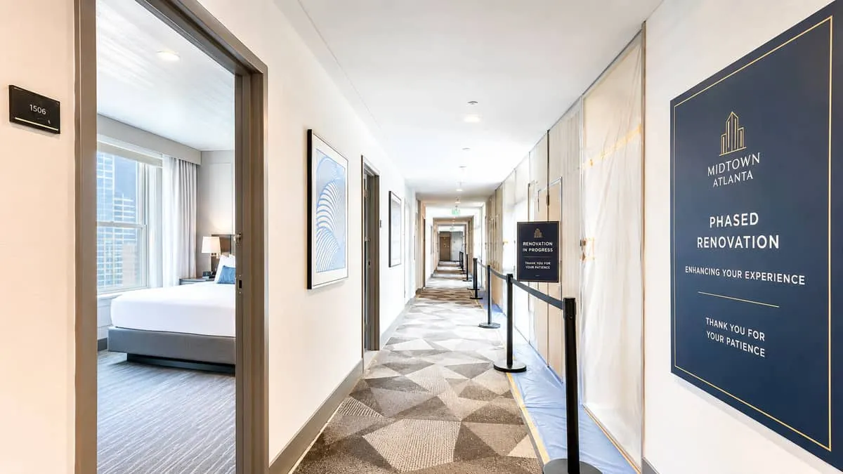 Hotel renovation furniture installation crew working in occupied Atlanta property with white-glove delivery and room staging