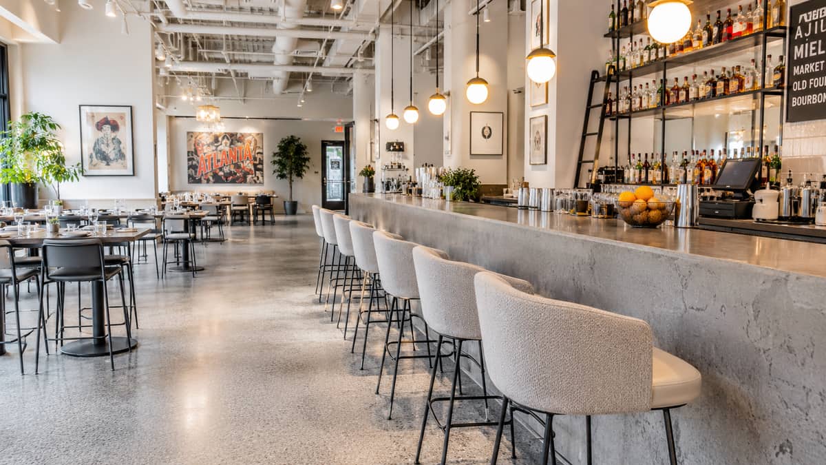 Restaurant table and base specifications for a Fort Wayne venue showing cast-iron pedestal base with commercial laminate top