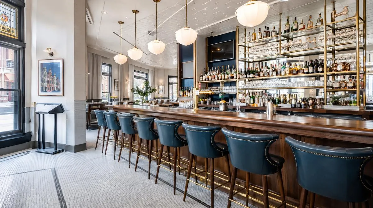 Bar and lounge furniture serving a River Market District venue in Little Rock, showing heavy-gauge steel barstools with welded joints built for convention-night volume