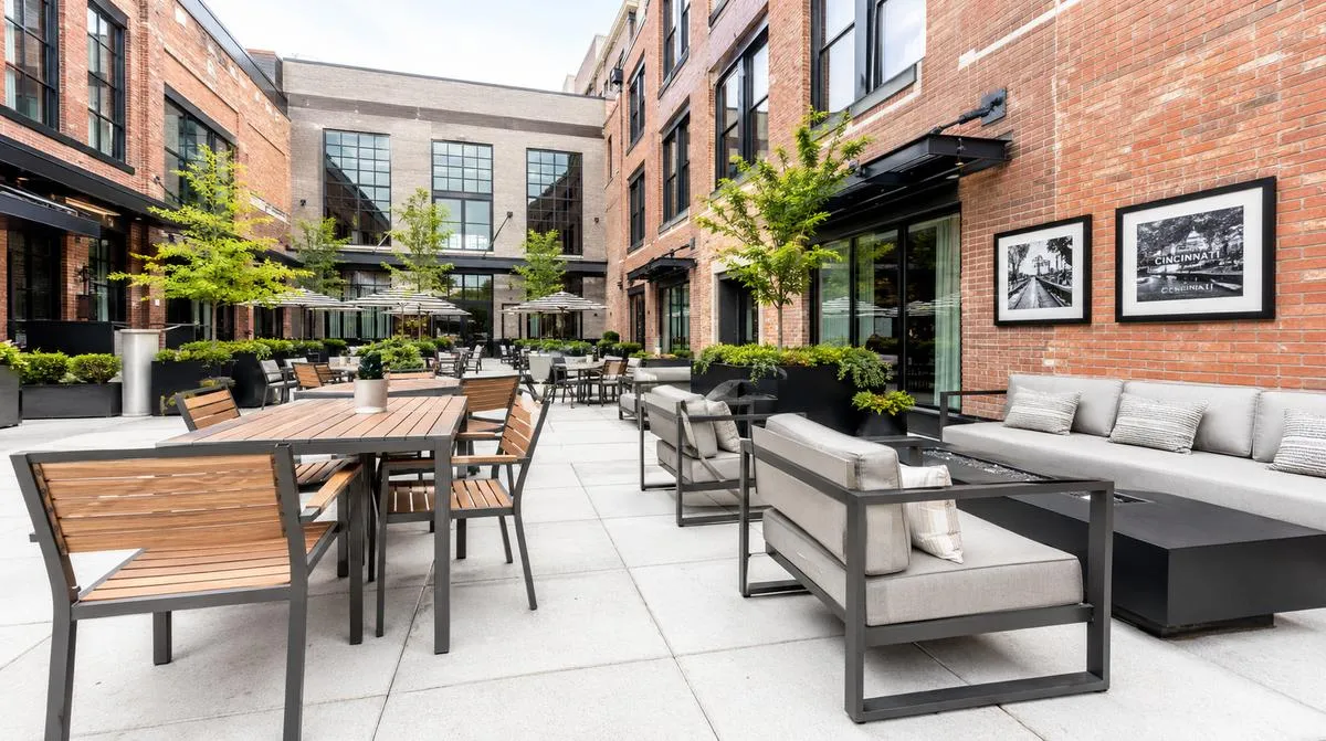 Commercial patio furniture with powder-coated aluminum frames on a Baton Rouge hotel terrace, built for humid climate durability