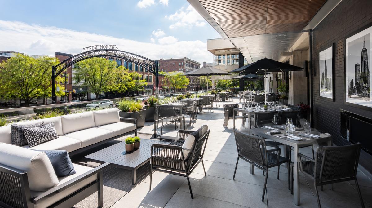 Little Rock River Market District patio furniture showing matte bronze powder-coat aluminum lounge seating suited to a riverfront hospitality corridor