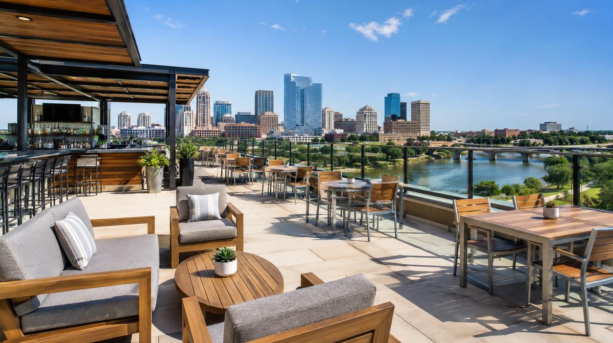 Federal Hill Providence cocktail bar lounge furniture showing curved banquette seating with warm-toned upholstery and solid wood tables